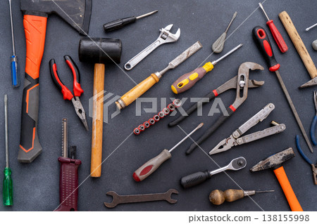 Different set hand tools top view hammers screwdrivers pliers, wrenches and clamps. DIY repair background Different set hand tools top view hammers screwdrivers pliers, wrenches and clamps. DIY repair background 138155998
