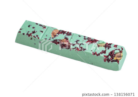 Green craft chocolate bar with dried berry pieces on white background artisan handmade gourmet confectionery Green craft chocolate bar with dried berry pieces on white background artisan handmade gourmet confectionery 138156071