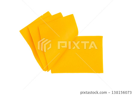 Stack of yellow cheese slices on white backdrop processed dairy ingredient for grilled cheese burgers and snacks 138156073