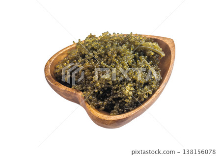 Bowl of sea grapes also known as green caviar and sea caviar served with soy sauce on isolated background Asian umibudo seaweed Bowl of sea grapes also known as green caviar and sea caviar served with soy sauce on isolated background Asian umibudo seaweed 138156078
