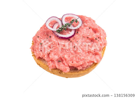 German mettbrotchen sandwich with raw minced pork onion rings and herbs on bread roll isolated on white background German mettbrotchen sandwich with raw minced pork onion rings and herbs on bread roll isolated on white background 138156309