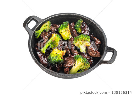 Beef and broccoli stir fry cooked in wok style sauce served in small skillet on isolated background Beef and broccoli stir fry cooked in wok style sauce served in small skillet on isolated background 138156314