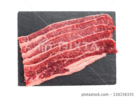 Raw marbled beef short plate slices on cutting board, premium angus meat with rich fat texture isolated on light background Raw marbled beef short plate slices on cutting board, premium angus meat with rich fat texture isolated on light background 138156335
