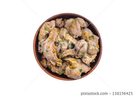 Cooked chicken gizzards with herbs served in wooden bowl on white background perfect for clean food photography and recipe design. 138156425