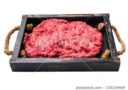 Raw ground wild boar meat (mince) in a dark rustic wooden tray with rope handles, isolated on a white background. Top view. Raw ground wild boar meat (mince) in a dark rustic wooden tray with rope handles, isolated on a white background. Top view. 138156469