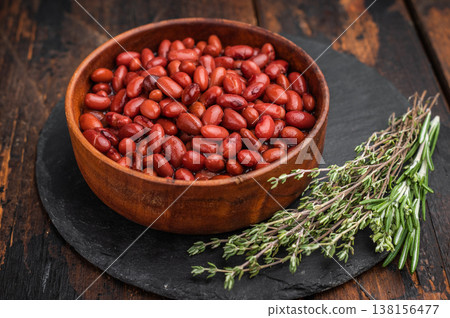 Simple, wholesome portion of kidney beans in a rustic wooden dish. Ideal for diet, vegetable, and vegan recipe blogs. 138156477