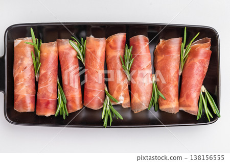 rolled Jamon/Prosciutto slices. Clean and simple isolated food ingredient for recipe design. rolled Jamon/Prosciutto slices. Clean and simple isolated food ingredient for recipe design. 138156555