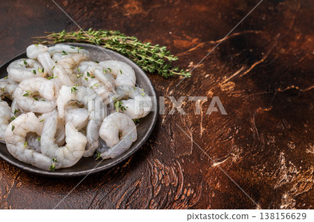 Fresh seafood prawn shrimp and gourmet ingredients ready for cooking. Top view on a wooden cutting board with spices. Fresh seafood prawn shrimp and gourmet ingredients ready for cooking. Top view on a wooden cutting board with spices. 138156629