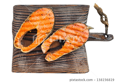 Grilled sockeye salmon steaks on wooden board isolated on clean light background Grilled sockeye salmon steaks on wooden board isolated on clean light background 138156819