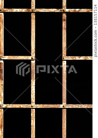 Rusty metal grid pattern against a black background Rusty metal grid pattern against a black background 138157114