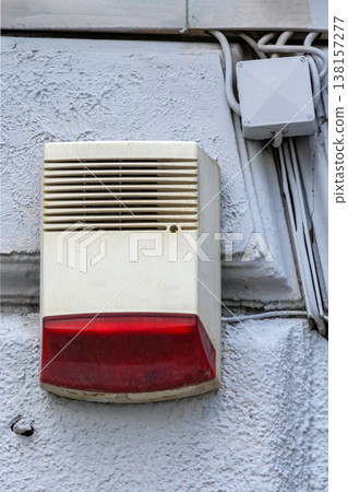 Alarm security unit on house facade 138157277