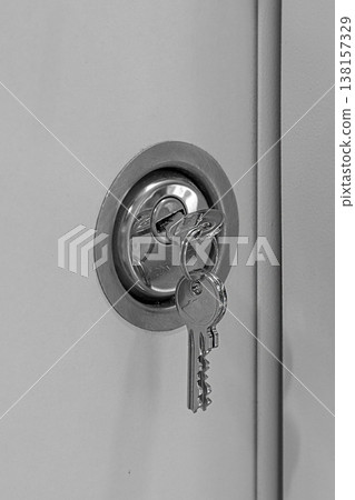 Key in a door keyhole Key in a door keyhole 138157329
