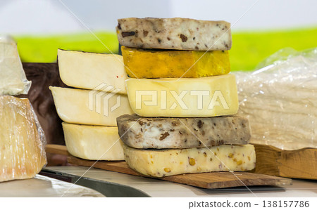 Stack of cheese on market Stack of cheese on market 138157786