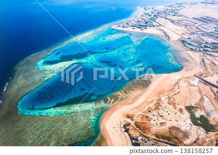 Beautiful view from plane window on the reefs and hotels Beautiful view from plane window on the reefs and hotels 138158257