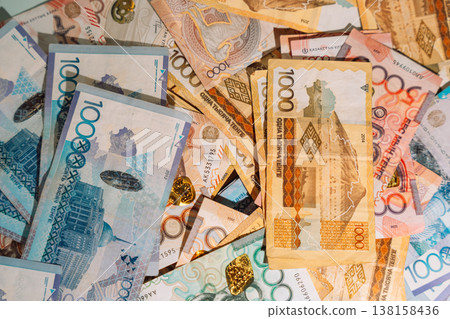 Background of Kazakhstani tenge banknotes, cash money texture and finance concept Background of Kazakhstani tenge banknotes, cash money texture and finance concept 138158436