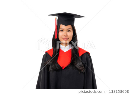 A woman stands smiling in her graduation cap and gown, isolated, PNG A woman stands smiling in her graduation cap and gown, isolated, PNG 138158608