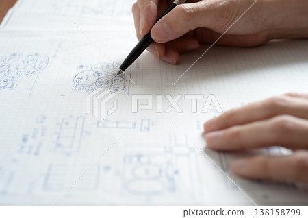A man sketching a plan for the first-class architect design and drafting examination. A man sketching a plan for the first-class architect design and drafting examination. 138158799