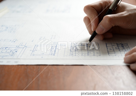 A man sketching a plan for the first-class architect design and drafting examination. A man sketching a plan for the first-class architect design and drafting examination. 138158802