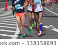 The dynamic movement of the feet and running shoes of amateur runners running smoothly in a marathon 138158893
