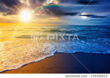 vacation at the sea on autumn equinox. day meet night. sun and moon over beautiful seascape. waves wash the sandy beach. image with epic sky above horizon. background for relaxation or ads placement 138160019
