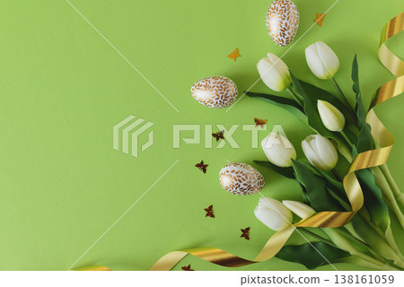 Easter Eggs with Tulips, butterflies confetti and Ribbon on Green Background 138161059