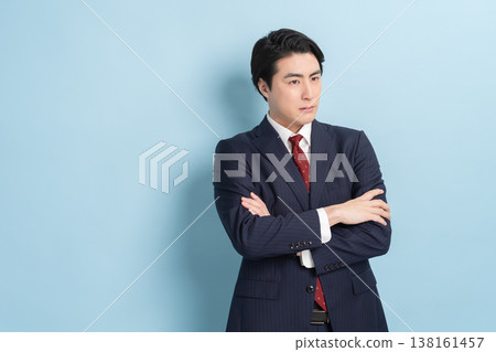 Cool businessman (blue background) Cool businessman (blue background) 138161457