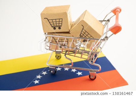 Shopping cart box on Venezuela flag, import export, finance commerce. Shopping cart box on Venezuela flag, import export, finance commerce. 138161467