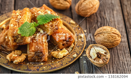 Traditional arabic dessert Baklava with honey and walnuts. Traditional arabic dessert Baklava with honey and walnuts. 138162094