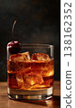 Close up whiskey old fashioned with cherry and ice cubes 138162352