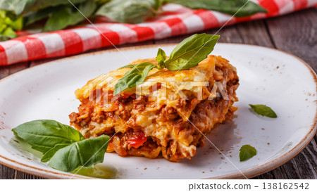 Traditional lasagna made with minced beef bolognese sauce 138162542