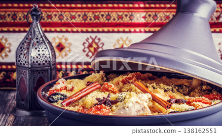 Traditional moroccan tajine of chicken with dried fruits and spices. Traditional moroccan tajine of chicken with dried fruits and spices. 138162551