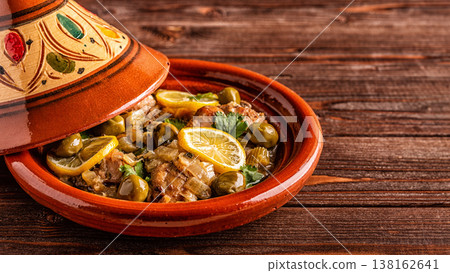 Traditional Moroccan chicken tagine with olives and salted lemons Traditional Moroccan chicken tagine with olives and salted lemons 138162641