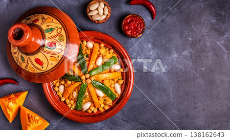Vegetable tagine with almond and chickpea couscous Vegetable tagine with almond and chickpea couscous 138162643