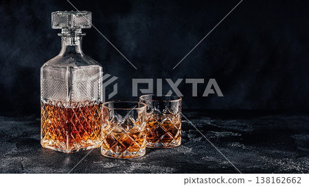 Glasses of the whiskey with a square decanter 138162662