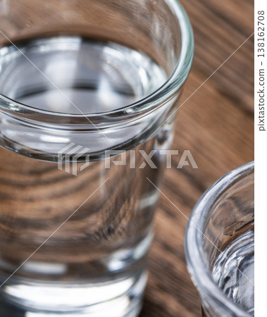 Vertical vodka shot close up alcohol Vertical vodka shot close up alcohol 138162708