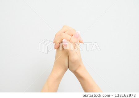 Close-up of a Japanese woman's hand with natural-looking nail polish. 138162978