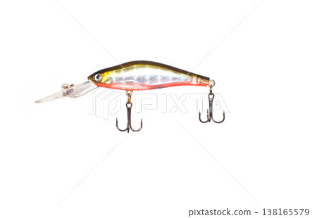 Fishing lure minnow style gold and red metallic body transparent lip two treble hooks isolated white background studio shot. Fishing lure minnow style gold and red metallic body transparent lip two treble hooks isolated white background studio shot. 138165579