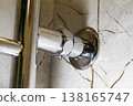 Leaking heated towel rails due to old gaskets, plumbing problem. Copy space for text 138165747