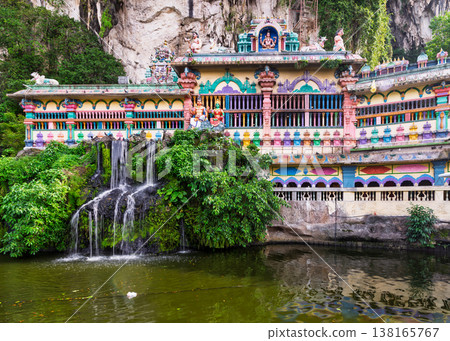 Vibrant Hindu temple facade and waterfall at Batu Caves Cave Villa, Kuala Lumpur Malaysia Vibrant Hindu temple facade and waterfall at Batu Caves Cave Villa, Kuala Lumpur Malaysia 138165767