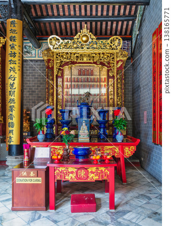 Ornate altar inside Chan She Shu Yuen Ancestral Hall with offerings and ancestral tablets, Kuala Lumpur Malaysia Ornate altar inside Chan She Shu Yuen Ancestral Hall with offerings and ancestral tablets, Kuala Lumpur Malaysia 138165771