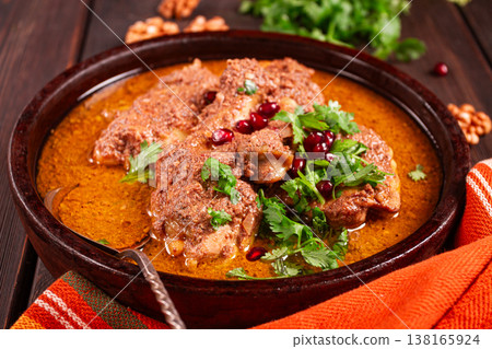 fesenjan, an Iranian dish, stewed chicken, in walnut-pomegranate sauce, in an earthen pan, homemade, no people, fesenjan, an Iranian dish, stewed chicken, in walnut-pomegranate sauce, in an earthen pan, homemade, no people, 138165924