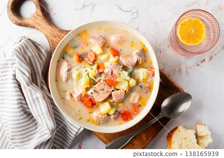 a bowl of soup on a light background, Finnish fish soup, lohikeito soup, creamy fish soup, a bowl of soup on a light background, Finnish fish soup, lohikeito soup, creamy fish soup, 138165939
