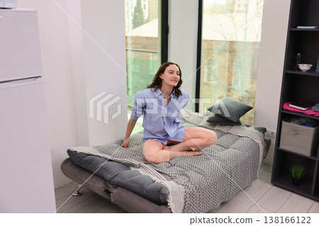 Relaxing morning in a bright modern apartment with cozy decor and a unique touch of style Relaxing morning in a bright modern apartment with cozy decor and a unique touch of style 138166122