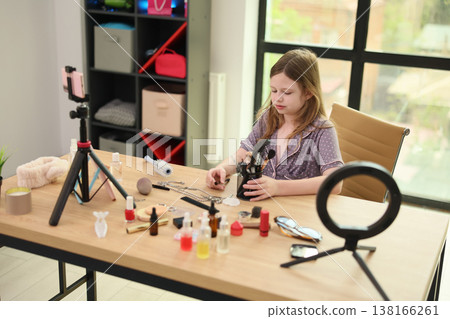 Young artist creates a cosmetic masterpiece at a modern workspace with vibrant surroundings Young artist creates a cosmetic masterpiece at a modern workspace with vibrant surroundings 138166261