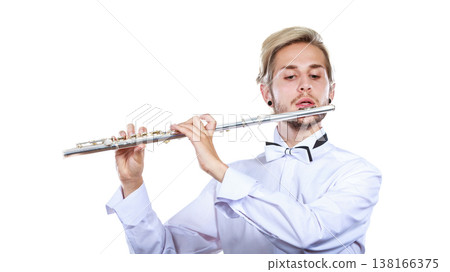 Male flutist playing his flute 138166375