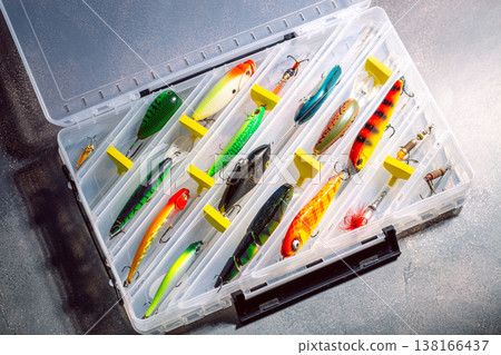 Large fisherman tackle box fully stocked with lures and gear for fishing. Kit of lures and fishing accessories Large fisherman tackle box fully stocked with lures and gear for fishing. Kit of lures and fishing accessories 138166437