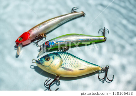 Fishing hobby concept. Accessories on blue background Fishing hobby concept. Accessories on blue background 138166438