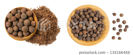 Allspice pepper and ground in wooden bowl isolated on white background. Jamaica pepper, Pimenta dioica or myrtle pepper. Top view Allspice pepper and ground in wooden bowl isolated on white background. Jamaica pepper, Pimenta dioica or myrtle pepper. Top view 138166488