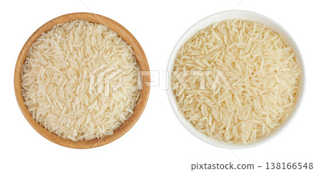 rice basmati in a wooden and ceramic bowl isolated on white background. Top view. Flat lay rice basmati in a wooden and ceramic bowl isolated on white background. Top view. Flat lay 138166548