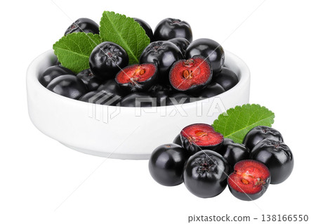 Chokeberry in ceramic bowl isolated on white background. Black aronia. Chokeberry in ceramic bowl isolated on white background. Black aronia. 138166550